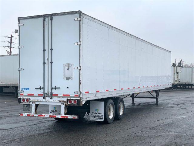 2013 Stoughton dry van trailer seen from rear-left side showing double rear doors and tandem axle wheels.