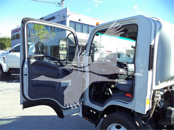 Isuzu NRR dump truck cab with driver door open