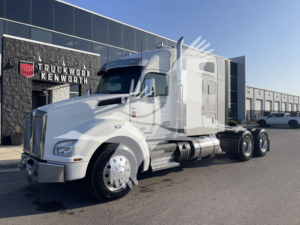 2020 Kenworth T880 truck in front of dealership, white cab with sleeper, stock number U8206, VIN 1XKZDP9X3LJ427681 visible in listing.