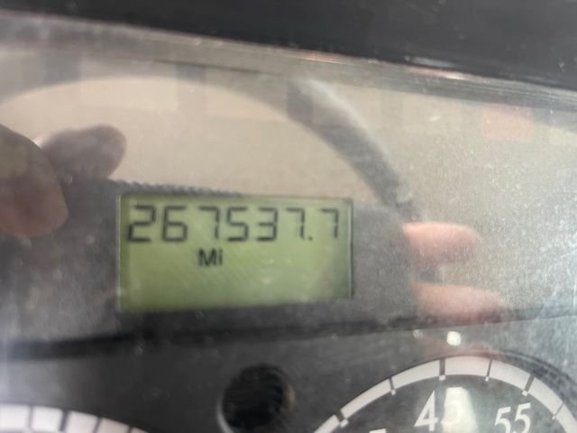 Dashboard odometer displaying 267537.7 miles in a Freightliner M2 truck.