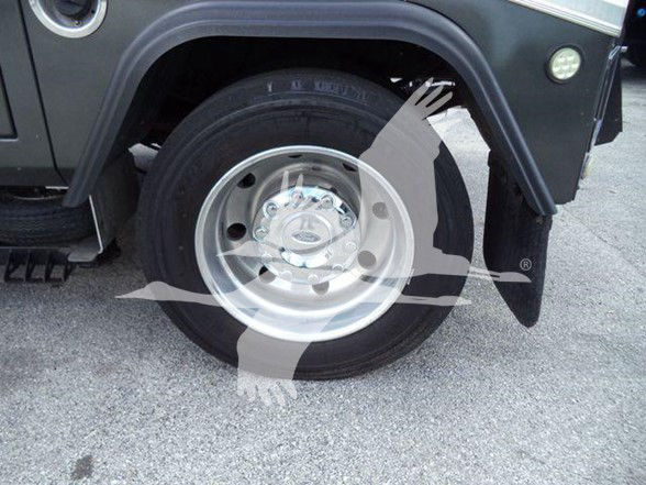  Ford F-450 wheel close-up with tire and fender visible in tow truck, partial truck body