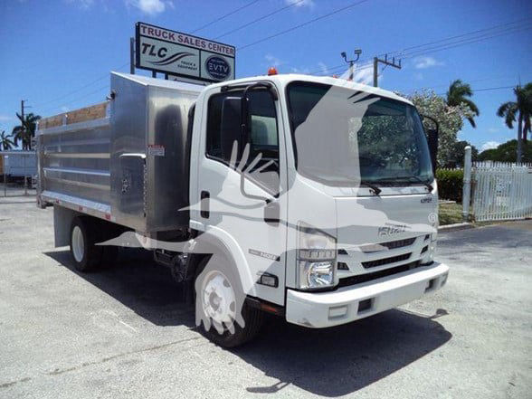 Isuzu NQR dump truck in a dealership lot with aluminum dump body and crew cab front view.
