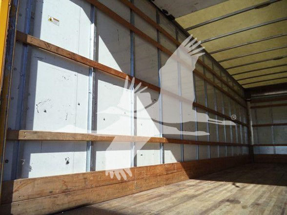 Box truck cargo area interior with wooden floor and metal walls.