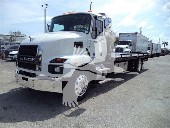 Front-left view of a white 2024 Mack MD6 tow truck with attached trailer in a lot.