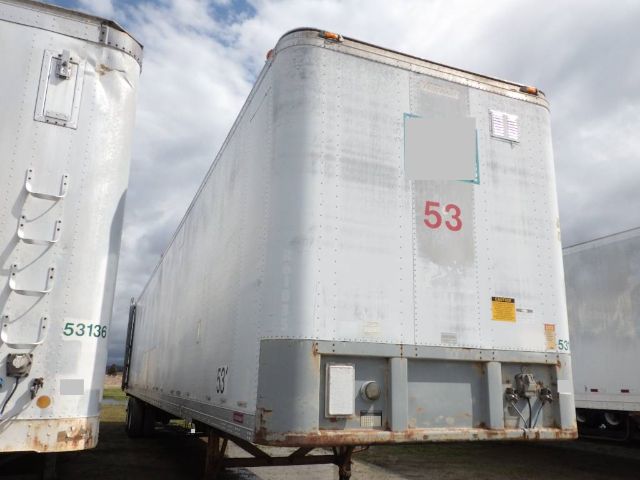 Fruehauf storage/short haul trailer in used condition with large red 53 on rear, silver body, and support legs visible.