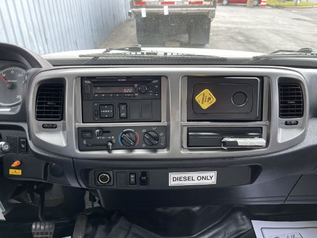 Dashboard of a 2017 Hino 268 box truck interior showing steering wheel, radio, climate controls, diesel only label, and compartments.