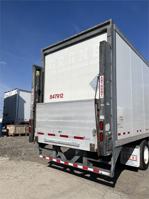 Rear view of a 2018 Vanguard dry van trailer with liftgate and serial number 847912 visible on the back.