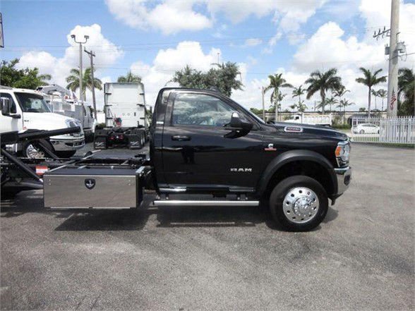 Ram 5500 chassis cab with side storage toolbox and utility body in black, front wheel visible, stock number J67261.