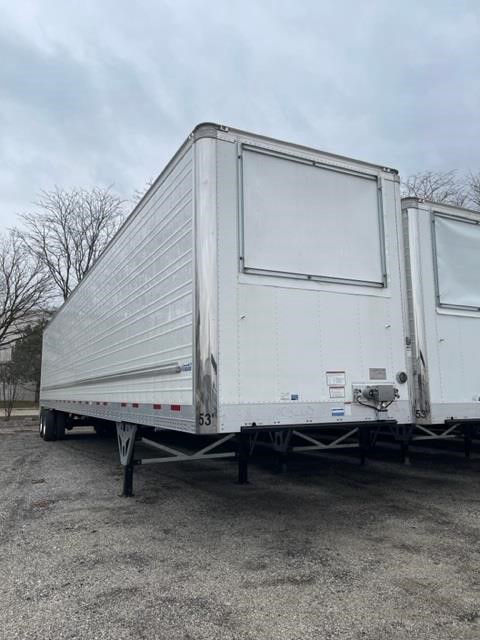 Reefer trailer with CIMC Cool Globe logo, side and rear view showing white aluminum panels, upper hatch, and undercarriage with landing legs.