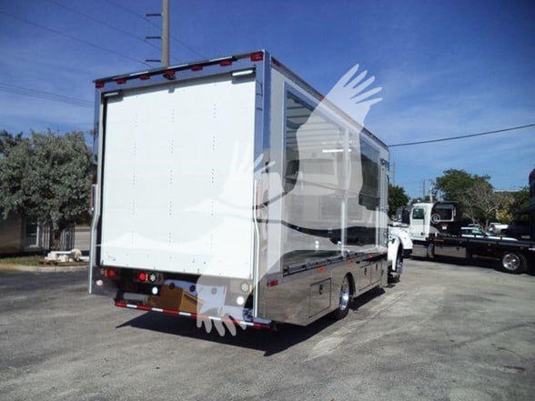 Kenworth T280 box truck rear and passenger side showing cargo box and chrome finish with reflective sides.