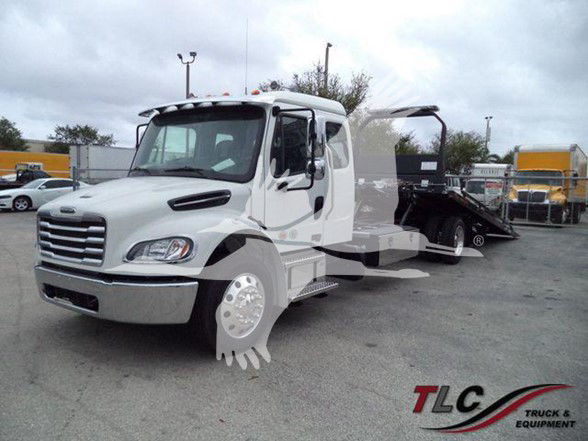 Freightliner Business Class M2 106 tow truck front-left view with hydraulic tilt bed, stock number JU6168FM.