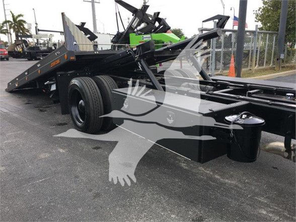 Peterbilt 337 tow truck chassis showing mid- to rear-section with black finish and twin rear axles.
