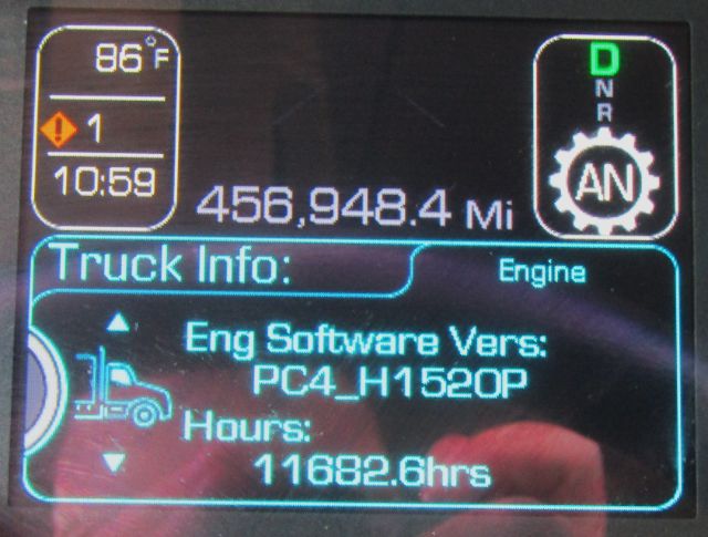 Truck dashboard screen showing 456,948.4 miles, engine software version PC4_H1520P, hours 11682.6, gear indicator D N R A, and a blue Truck Info panel.
