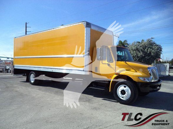 Yellow box truck with brown cargo box and chrome bumper. Side shows no text; TLC Truck & Equipment logo bottom right.