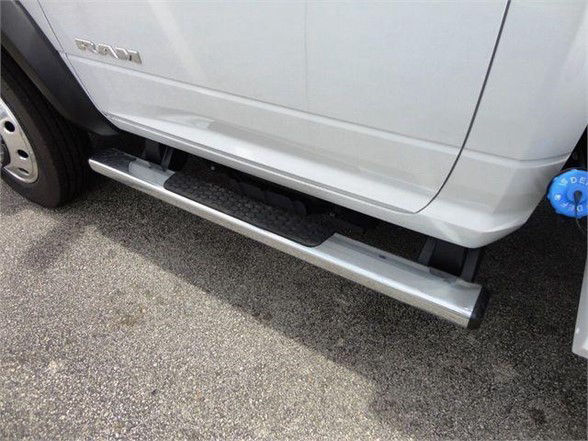 Ram 4500 SLT side running board view showing lower door area and step rail.