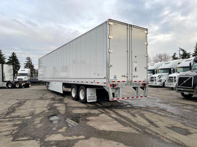 2021 Hyundai dry van trailer showing exterior of large white cargo box with tandem axles and rear doors.