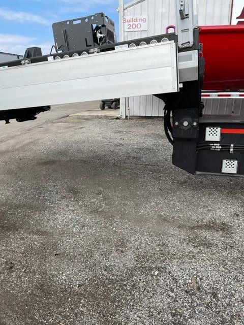 Trailer tail with extended aluminum drop deck and rear bumper, part of a 2023 STZ-P9 (3+3+3) AA model. Visible labels and structural components on the deck.