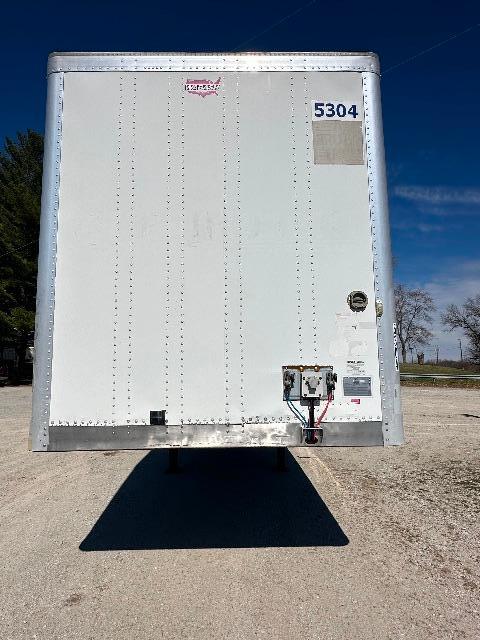 Trailer rear door of a 2015 Wabash DuraPlate Dry Van with stock number 5304, visible VIN 1JJV532D5FL840508 and utility connections at lower right.