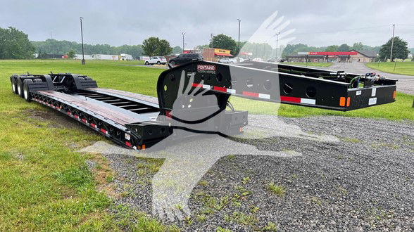  Fontaine Workhorse lowboy trailer with long black platform and gooseneck, showing hydraulic ramps and deck rails.