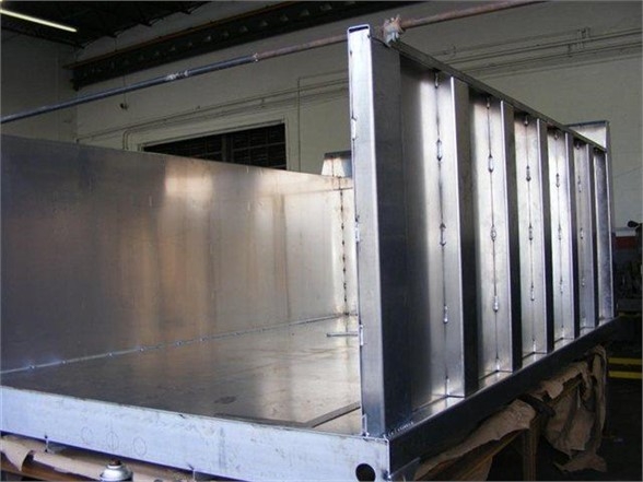 12 ft dump body bed in aluminum with tall side panels, open top, mounted on truck chassis.