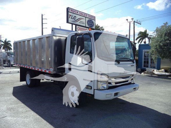 Isuzu NPR HD dump truck in a vehicle lot showing the cab and dump bed.