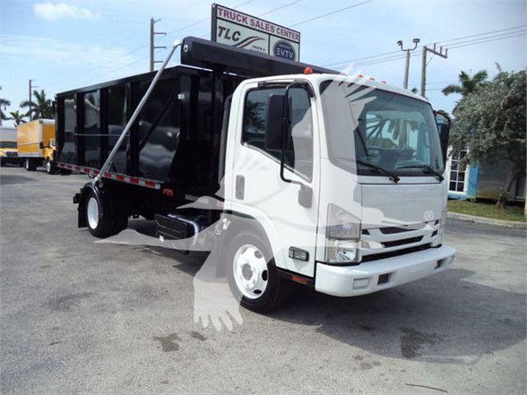 Isuzu NRR garbage truck with white cab and black refuse body, side view showing cargo bed and hydraulic lift, front grille visible.