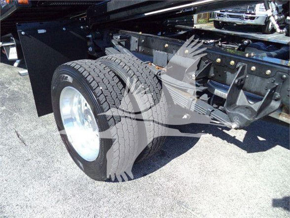 Ram 5500 truck chassis showing dual rear tires and frame with suspension components.