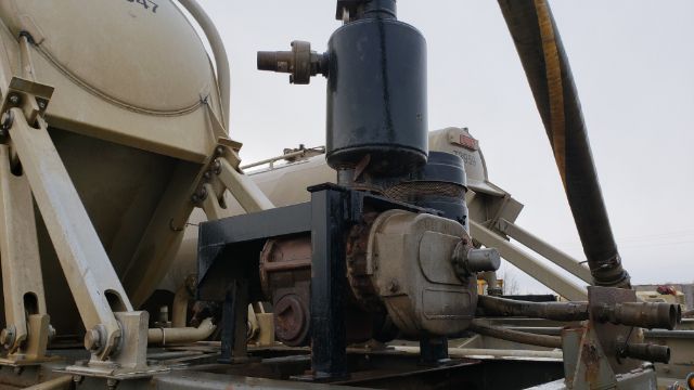 [Component] [View] showing a pump and tank assembly on a trailer with pneumatic system and hoses.