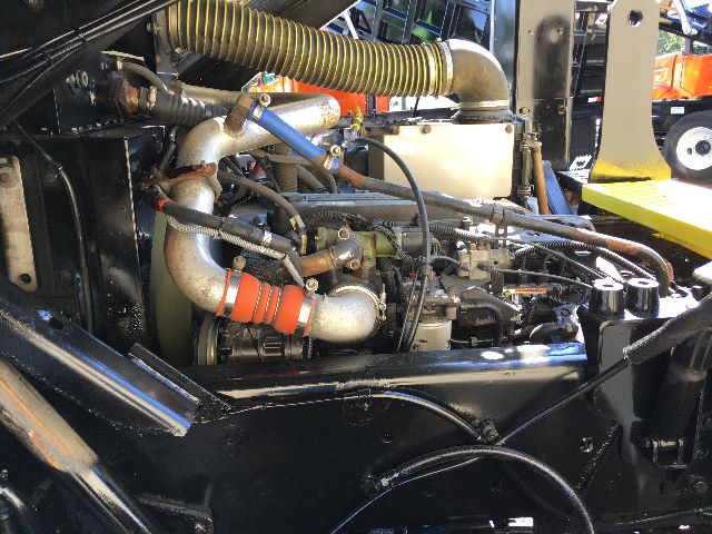 Kalmar Ottawa YT30 engine bay with hoses, turbo, and fuel lines visible