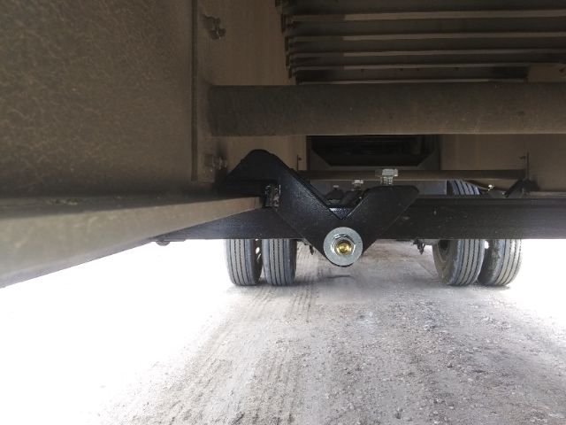 Under trailer showing Dunnage Rack support bracket with bolt and cross member.