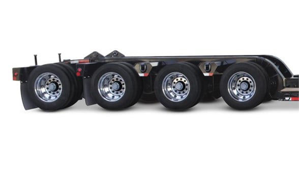  Fontaine 4th axle flip lowboy trailer side view showing five axles with black tires and silver rims.
