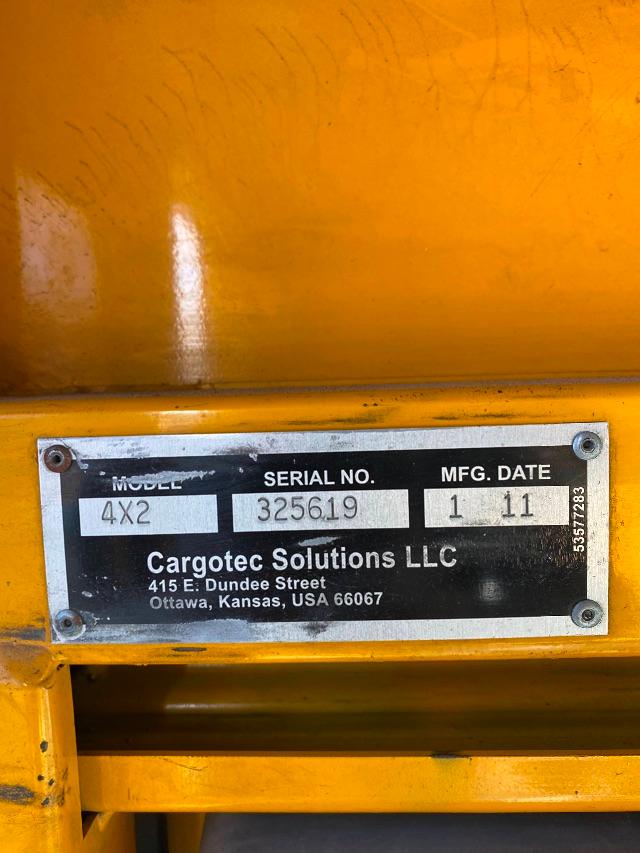 Plate on yellow yard spotter showing Model 4x2, Serial No. 325619, Mfg. Date 1 11, Cargotec Solutions LLC address in Ottawa, Kansas.