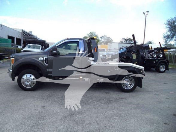Auto tow truck side view with F-450 chassis and hydraulic boom in black and white graphics overlaid.
