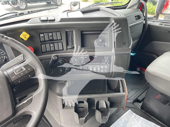 Volvo VNL64T740 truck interior showing dashboard, steering wheel, gear shifter, and center console