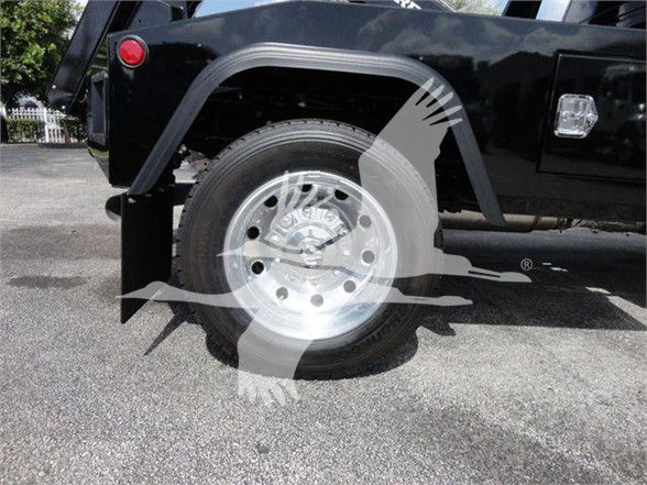 [Component] [Wheel/Tire area] showing front wheel and fender of a black truck with watermark overlay.