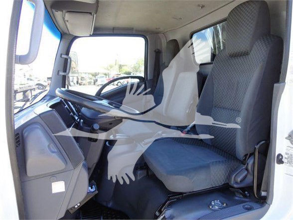 Isuzu NRR truck interior showing driver and passenger seats and dashboard.
