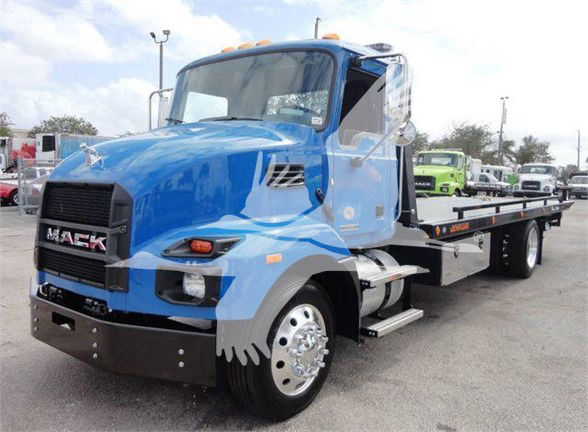 Tow truck with blue Mack MD6 cab and flatbed, front grille reads 'MACK' with chrome bumper, side mirrors, and orange clearance lights on roof.