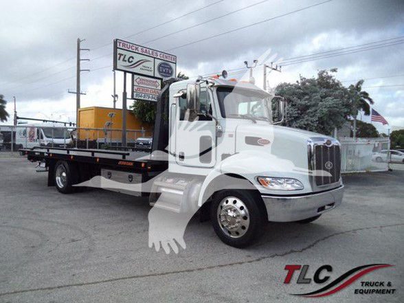 2019 Peterbilt 337 tow truck side view showing cab and bed with TLC Truck & Equipment logo in corner.