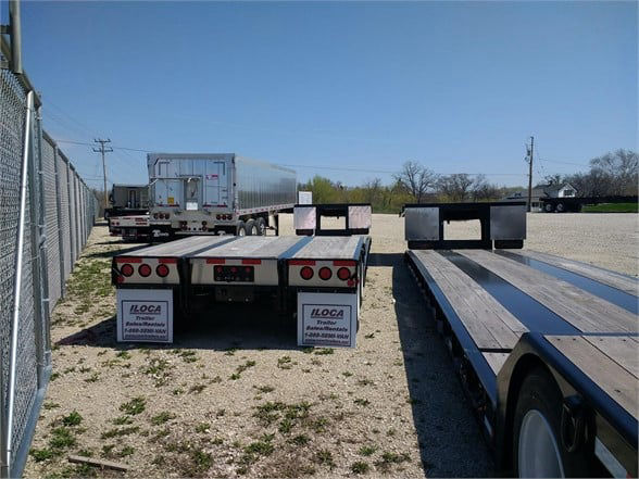 Fontaine 40-ton mechanical detachable double drop trailer on lot, rear view with dual drop deck sections and mudflaps.
