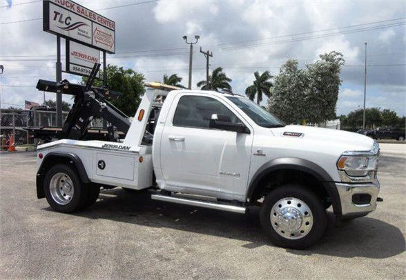 2024 Ram 4500 SLT tow truck side view with wheel-lift equipment and service body.