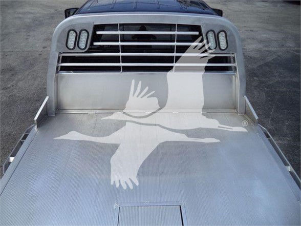 Ram 5500 SLT flatbed truck front grille and aluminum flatbed with eagle watermark