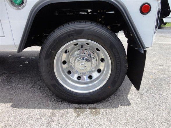Wheel and front fender of a Ram 4500 truck showing polished steel wheel and tire under the front quarter panel.