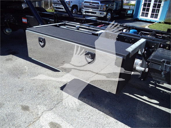 Isuzu FTR truck fuel/utility toolbox mounted on chassis with silver metal storage box and handles.