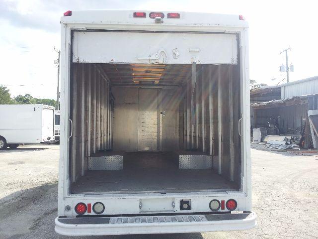 Workhorse P42 step van rear cargo area open showing empty interior with metal walls and rear tail lights.