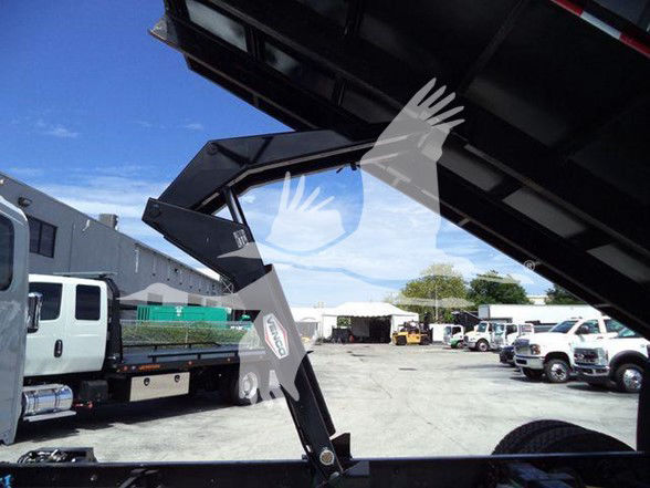 2019 International DURASTAR 4300 truck with a dump body; visible labels and components including hydraulic arms and a truck bed
