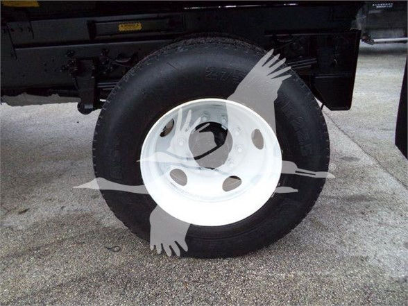 Wheel/tire on Ford F-650 SD truck with white steel wheel and black tire; watermark overlay present.