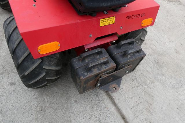 Steiner 415 agricultural equipment rear view showing large rugged tires and hitch assembly.