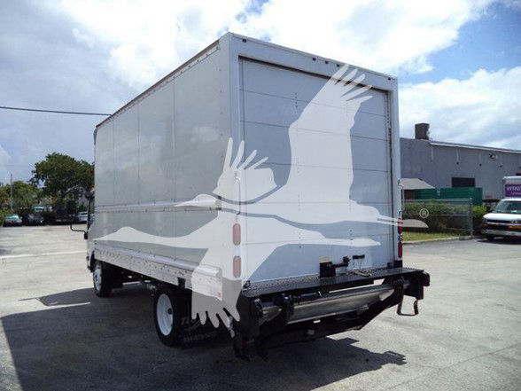 Isuzu NPR HD box truck rear view showing cargo box and rear bumper.