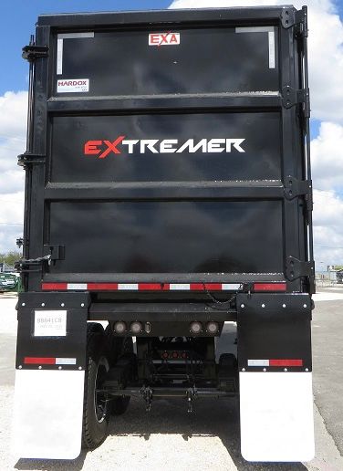 EXtremeR brand trailer back view showing Magna black steel frame with ExtremeR logo and rear bumper, mud flaps, and taillights.