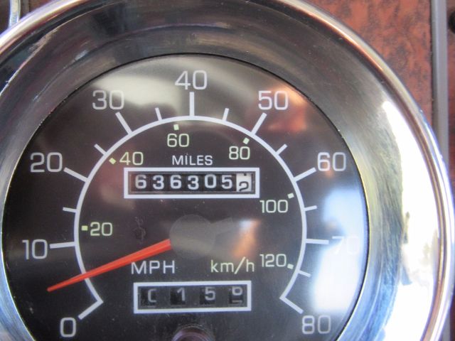 Kenworth T800 gauge cluster showing speedometer up to 80 mph and odometer reading 636305 miles; additional trip meter 0159.